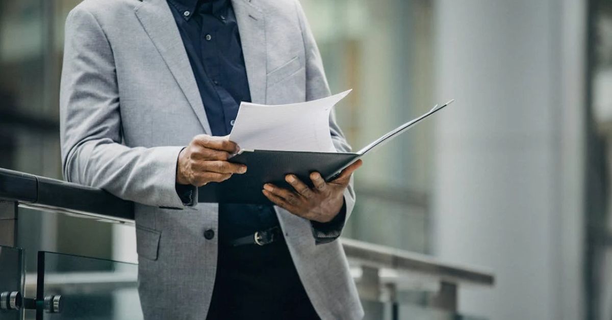 Person Looking Through Paperwork